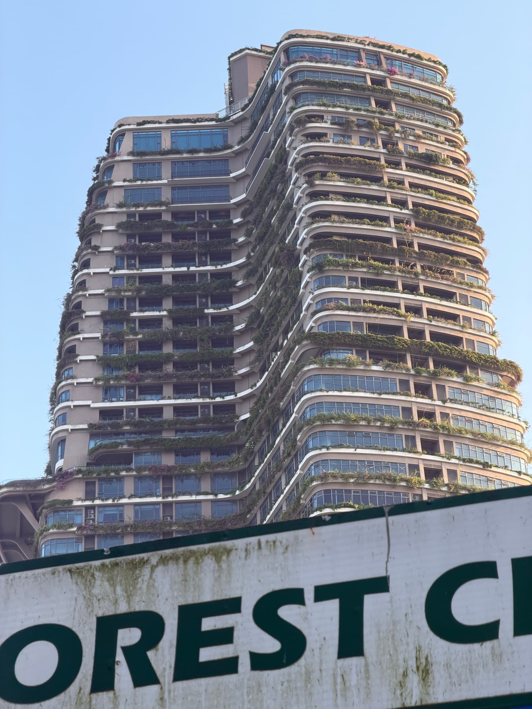 A planted high-rise curving into the Kuala Lumpur sky