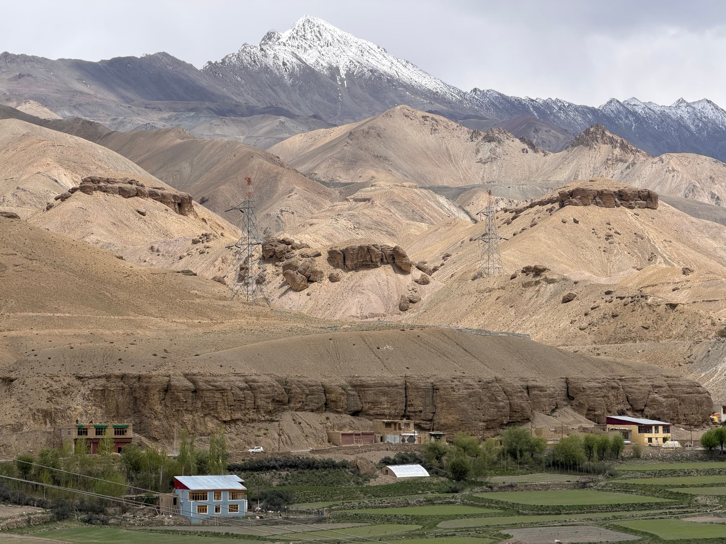 A snow-dusted mountain above a high valley